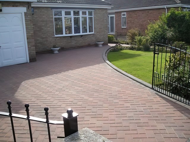 Clean block-paved driveway restored