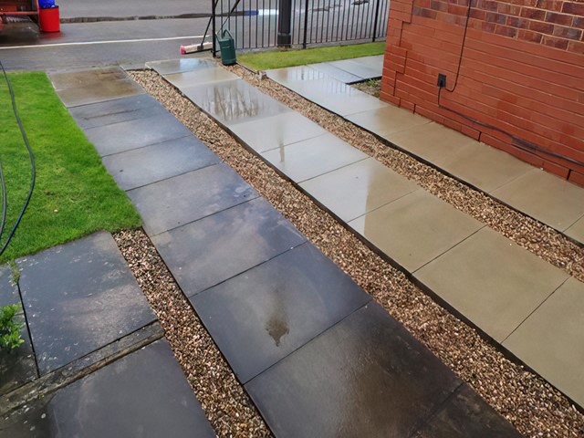 Cleaned paving slab driveway
