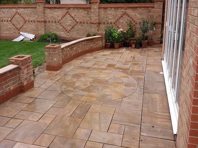 Sandstone patio cleaned with a circular feature